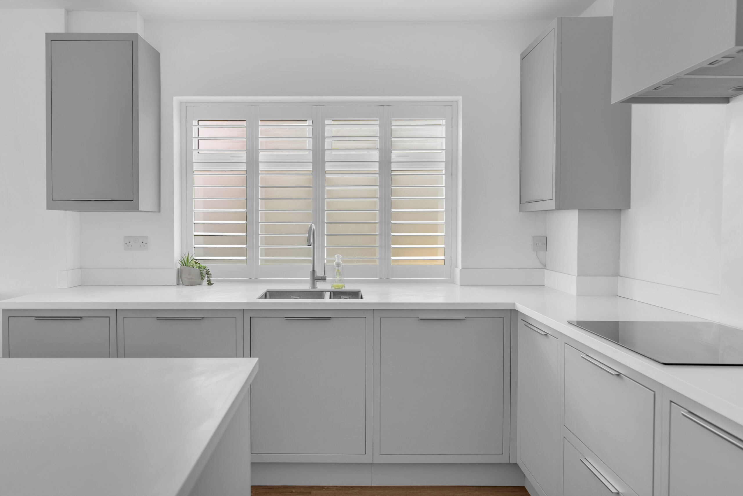 Kitchen with Plantation shutters designed by Cleethorpes Interiors